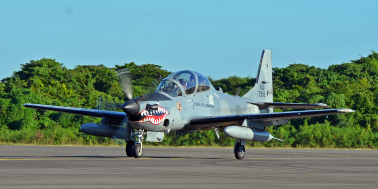 A Dominican Republic air force A-29 Super Tucano pilot taxis after a mission as part of an exercise to combat illegal drug trafficking Dec. 3, 2013, over the skies of the Caribbean. The exercise is part of the Sovereign Skies Program, an initiative between the U.S., Colombian, and Dominican Republic air forces to share best-practices on procedures to detect, track and intercept illegal drugs moving north from South America. (U.S. Air Force photo by Capt. Justin Brockhoff/Released)