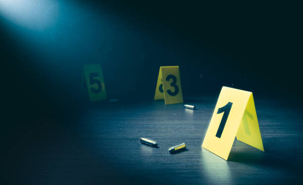 High contrast image of a crime scene with evidence markers