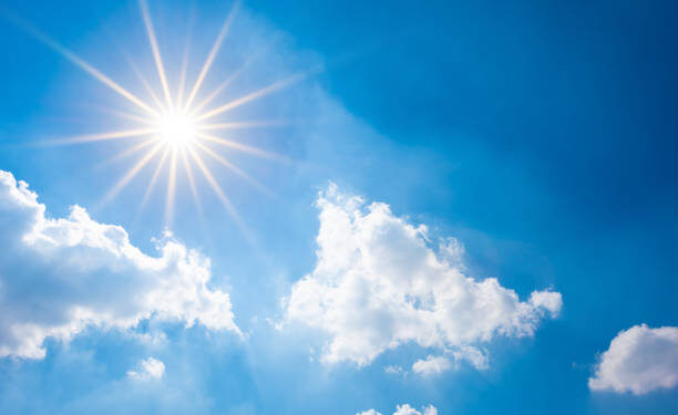 Sunny background, blue sky with white clouds and sun