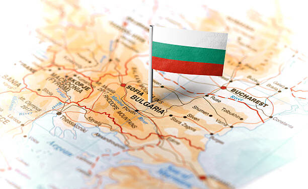 The flag of Bulgaria pinned on the map. Horizontal orientation. Macro photography.