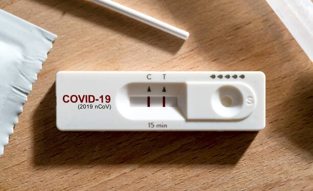 close up positive show result of covid infected show on nasal rapid self test kit at home