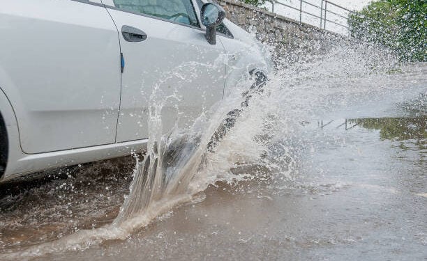 Car traveling on a flooded road