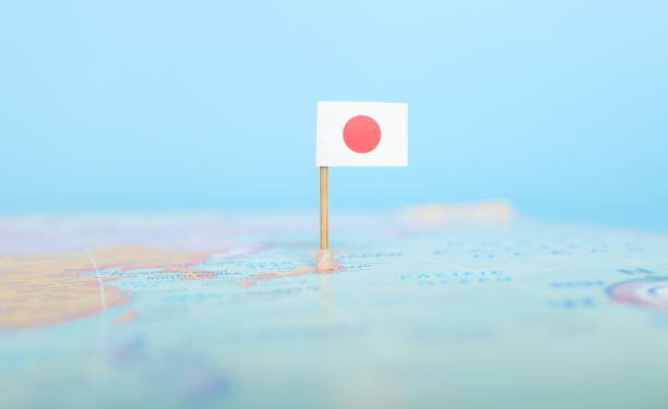 Selective focus of Japanese flag in world map. Japan country location and sovereignty concept.