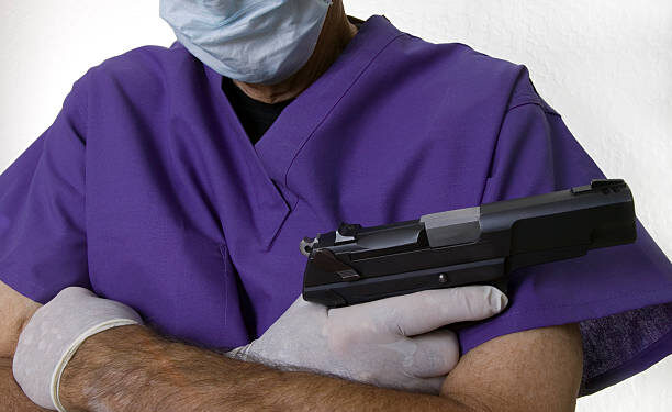 Doctor with gun says lots about high health and surgery costs.