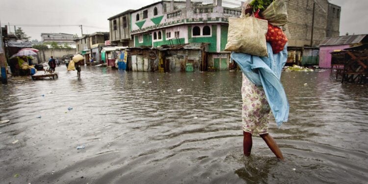 A woman walks through a flooded market in Port au Prince. Hurricane Sandy passed to the west of Haiti October 25, 2012 causing heay rains and winds, flooding homes and overflowing rivers.
Photo Logan Abassi UN/MINUSTAH