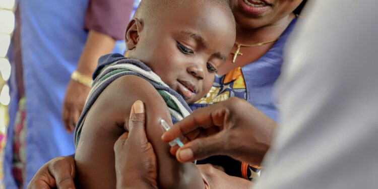 A brave little boy receiving his measles vaccine during the vaccination campaign in Impfondo