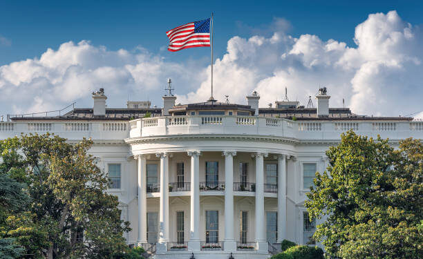 The White House in Washington DC at summer day. The White House is home of the President of the United States of America, Washington DC, USA.