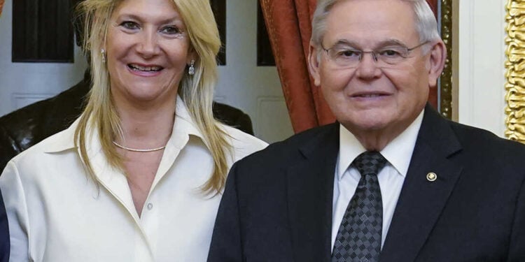 FILE - Senate Foreign Relations Committee Chairman, Sen. Bob Menendez, D-N.J., right, and his wife Nadine Arslanian, pose for a photo on Capitol Hill in Washington, Dec. 20, 2022. U.S. Sen. Bob Menendez of New Jersey and his wife have been indicted on charges of bribery. Federal prosecutors on Friday announced the charges against the 69-year-old Democrat nearly six years after an earlier criminal case against him ended with a deadlocked jury. (AP Photo/Susan Walsh, File)