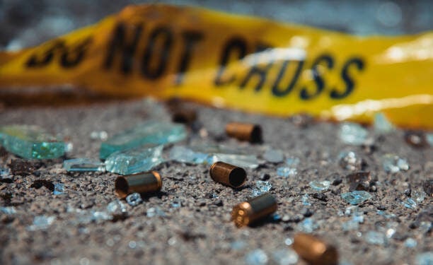 Bullet casings and broken glass. Crime scene.