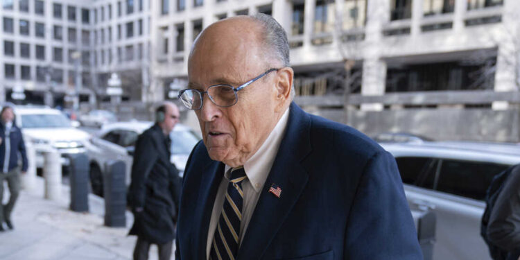 Former Mayor of New York Rudy Giuliani arrives at the federal courthouse in Washington, Wednesday, Dec. 13, 2023. The trial will determine how much Rudy Giuliani will have to pay two Georgia election workers who he falsely accused of fraud while pushing President Donald Trump's baseless claims after he lost the 2020 election. (AP Photo/Jose Luis Magana)
