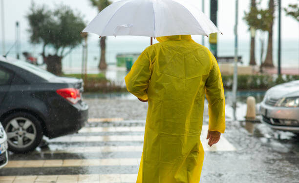 Man holding umbrella on a rainy day