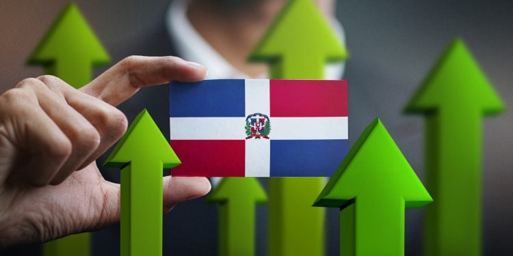 Nation Growth Concept, Green Up Arrows - Businessman Holding Card of Dominican Republic Flag