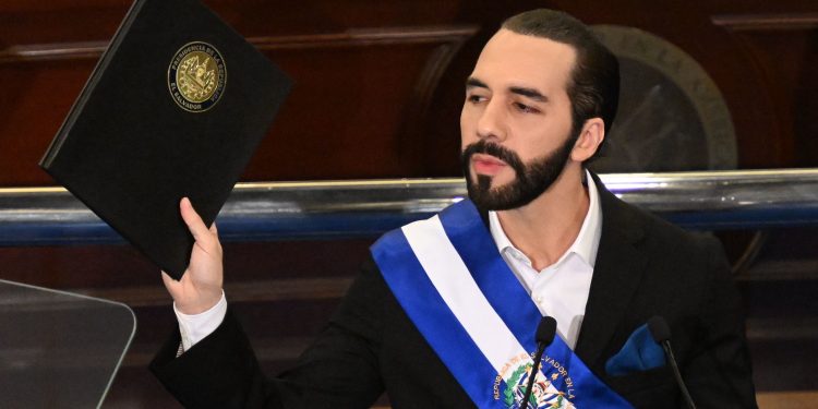 (FILES) Salvadoran President Nayib Bukele delivers his annual address to the nation marking his fourth year in office at the San Salvador Legislative Assembly on June 1, 2023. El Salvador's Nuevas Ideas (NI) party announced on June 26, 2023, that its leader, Nayib Bukele, has registered as a pre-candidate for the Presidency of the Republic to seek re-election in the 2024 elections, an option enabled by the justice system despite the fact that in theory the Constitution prohibits it. (Photo by MARVIN RECINOS / AFP)