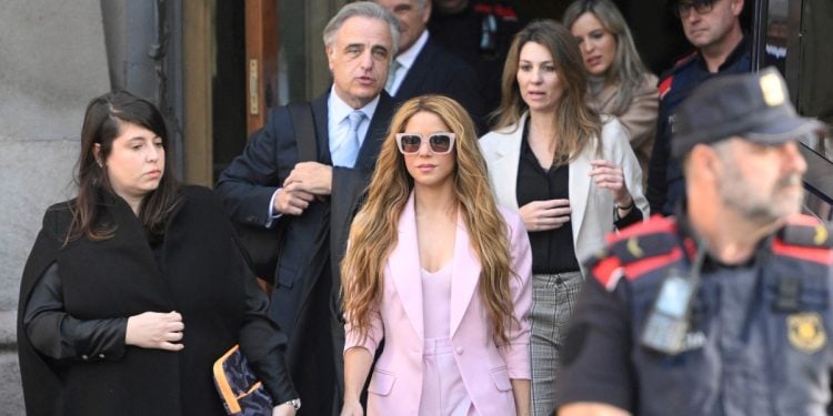 Colombian singer Shakira (C) leaves the High Court of Justice of Catalonia after attending her trial on tax fraud, in Barcelona on November 20, 2023. - Colombian superstar Shakira has reached a deal with prosecutors to end her trial for allegedly defrauding the Spanish state of 14.5 million euros ($15.7 million) on income earned between 2012 and 2014, a Barcelona court said. Under the deal, the 46-year-old agreed to receive a three-year suspended sentence in exchange for paying millions of euros in fines, the head of the court said on what would have been the first day of her trial. (Photo by Josep LAGO / AFP)
