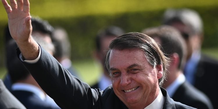 Brazil's president Jair Bolsonaro gestures to supporters after attending the National Flag Raising ceremony in front of Alvorada Palace amid the Coronavirus (COVID-19) pandemic, in Brasilia, Brazil, on Tuesday, October 27, 2020. (Photo by Andre Borges/NurPhoto)
