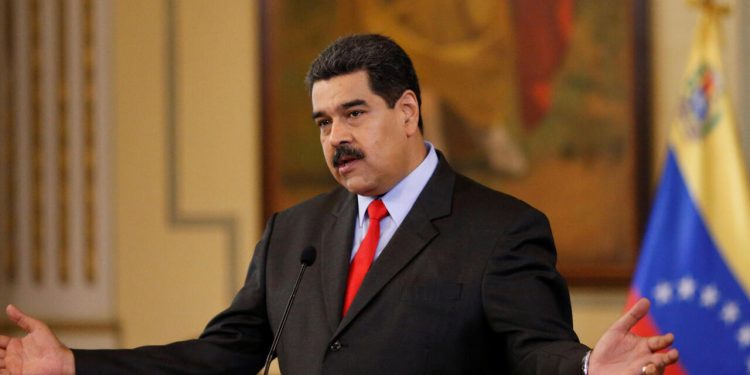 Venezuela's President Nicolas Maduro gestures as he talks to the media during a news conference in Caracas, Venezuela February 15, 2018. REUTERS/Marco Bello